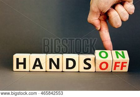 Hands On Or Off Symbol. Concept Words Hands On Hands Off On Wooden Cubes. Businessman Hand. Beautifu