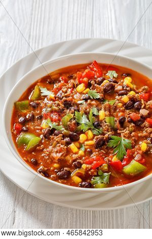 Taco Soup Of Ground Beef, Tomatoes, Chopped Green Chilis, Onions, Corn, Red Beans And Taco Seasoning