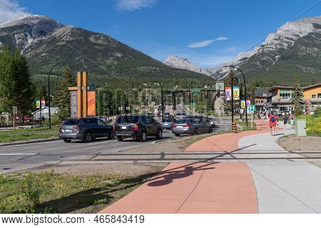 Canmore, Alberta, Canada - July 7, 2022: Busy Intersection With Cars And Sidewalks For Pedestrians I