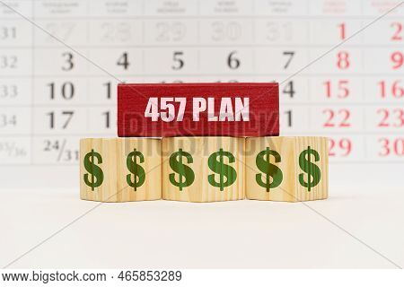 Business Planning Concept. Against The Background Of The Calendar There Are Cubes With The Image Of 