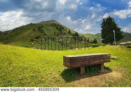 Glade Of Enthusiasts With A Bench For Tourists To Rest Before Climbing Mount Furmanov In The Almaty 
