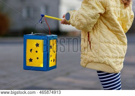 Closeup Of Little Preschool Kid Girl Holding Selfmade Traditional Lanterns With Candle For St. Marti