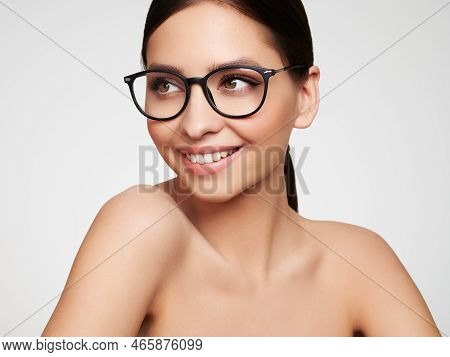 Close Up Of Young Woman With Eyeglasses On White Background. Vision Correction. Poor Eyesight. Spect