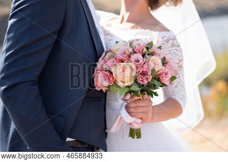 Hands On The Grooms Boutonniere. Wedding Decor For The Wedding Ceremony Of Flowers For Event Agencie