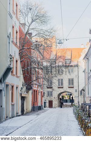 Riga, Latvia - November 20 2022: Beautiful Narrow Street With Cobblestones In Riga Old Town With Hou