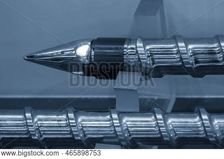Close Up Scene  The End Of Injection Machine Screw Spare Parts. The Manufacturing Concept Injection 