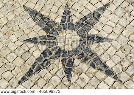 Image Closed Up With Stone Mosaic Pavement Portuguese Representing A Star, In Abrantes Portugal.
