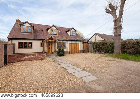 Toft, Cambridgeshire, England - March 4 2019: Traditional Style Modern Detached Home With Rendered E