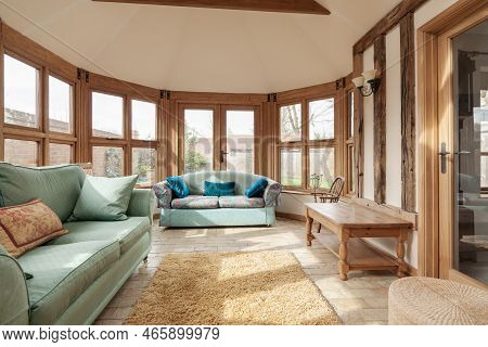 Toft, Cambridgeshire, England - March 4 2019: Furnished Traditional Luxury Garden Room With Brick Fl