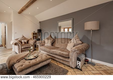 Toft, Cambridgeshire, England - March 4 2019: Luxury Modern Chic Furnished Living Room With Sofa, Fo