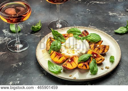 Gourmet Roasted Peaches With Burrata Soft Cheese, Basil And Drizzled With Honey, With Rose Wine. Ant