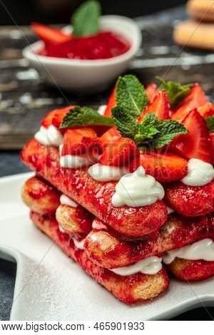 Tiramisu. Homemade Tiramisu Cake With Fresh Strawberry, Mascarpone And Mint. Tiramisu Portion On Pla