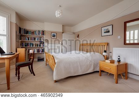Cambridge, England - August 24 2018: Traditional Furnished Luxury Bedroom Within Victorian Home With