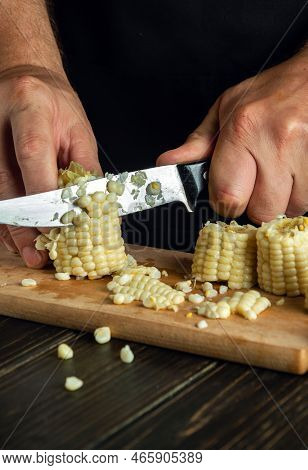 Professional Chef Cuts The Boiled Maize With A Knife. Corn Is An Excellent Dietary Breakfast Or Lunc
