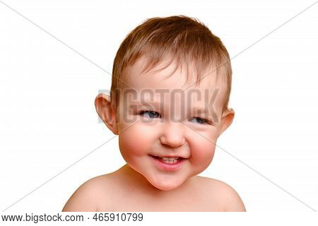 Sly Toddler Baby, Studio White Background, Copy Space. Portrait Of An Insidious Child With Red Cheek