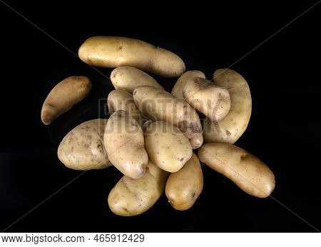 Ratte Potato In Front Of Black Background