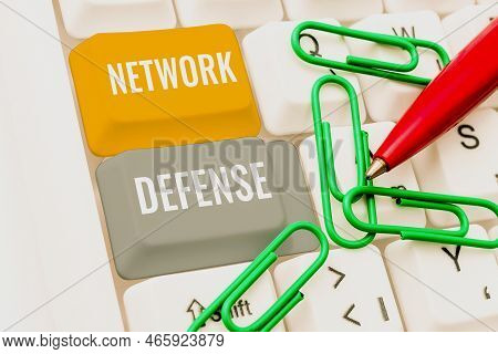 Hand Writing Sign Network Defense. Internet Concept Easures To Protect And Defend Information From D
