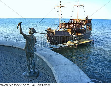 Berdyansk-ukraine 21 June 2012:
Monument To Fisherman And Fish Against Backdrop Of Sunset In Ukraini