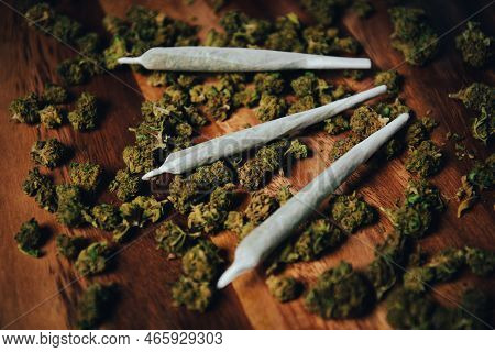 Joints Are On The Table. Three Crossed Joints In Marijuana Buds, Indica Sativa сbd Medicinal.