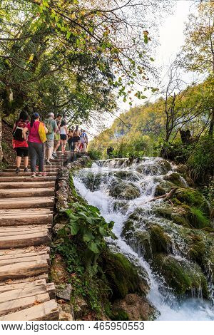 Plitvice, Croatia - September 13, 2016: Unidentified Tourists Follow The Route Along A Special Path 
