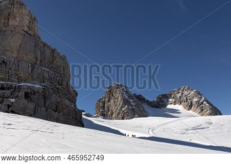 People And Mountains On A Clear Day On The Dachstein Glacier, Austria, Alps