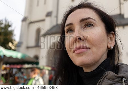 Large Female Portrait Against The Background Of A Tall Building, Austria, Salzburg
