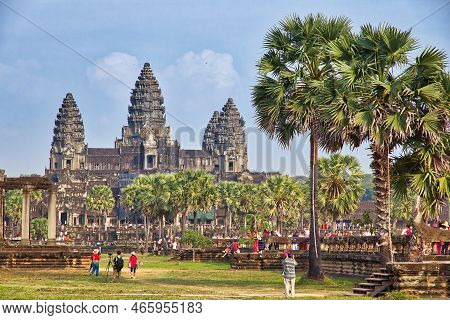 Siem Reap, Cambodia - December 9, 2013: People Visit Angkor Wat Temple Complex In Cambodia. The Temp