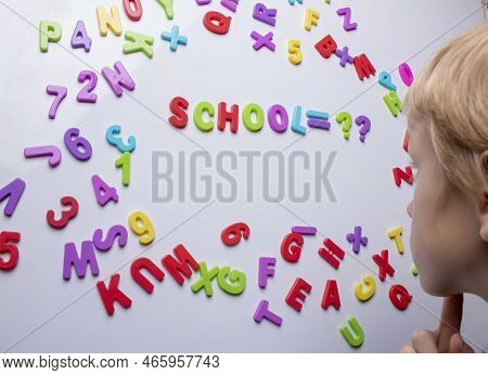 Schooler Thinking Near Blackboard, Math Concept. Close Up