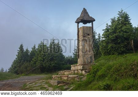 Stone Bell Tower In Jeseniky Mountains On A Summer Foggy Morning