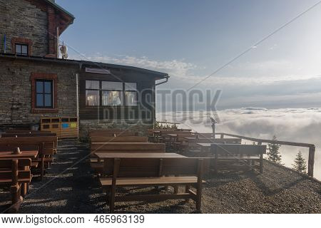 Old Stone Mountain  Cottage  In Jeseniky Mountains On A Summer Foggy Morning And  Sea Of Clouds Arou