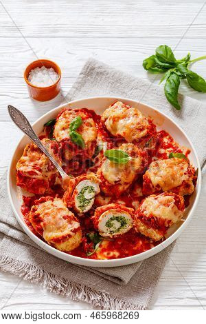 Chicken Rollatini With Spinach Ricotta Filling In Marinara Sauce Topped With Mozzarella Cheese And F
