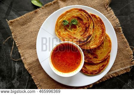Paratha Bread Or Canai Bread Or Roti Maryam, Favorite Breakfast Dish. Served On Plate