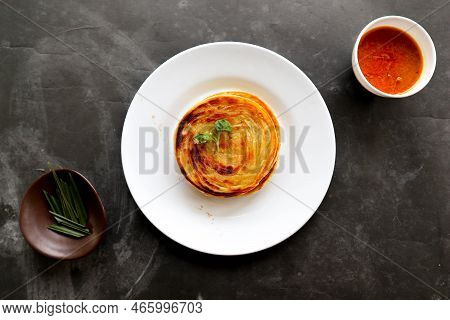 Paratha Bread Or Canai Bread Or Roti Maryam, Favorite Breakfast Dish. Served On Plate