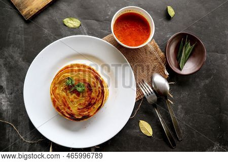 Paratha Bread Or Canai Bread Or Roti Maryam, Favorite Breakfast Dish. Served On Plate