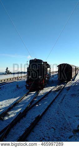 Brocken Steam Locomotice Running Up Hill Winter Blue Sky