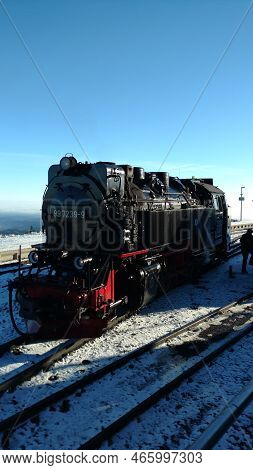 Brocken Steam Locomotice Running Up Hill Winter Blue Sky