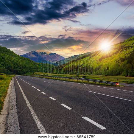 Asphalt Road In Mountains At Sunset