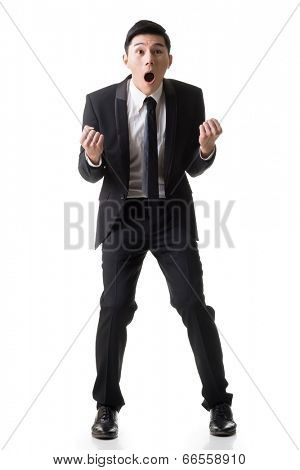 Asian business surprised with outrageously and funny pose, full length portrait isolated on white background.