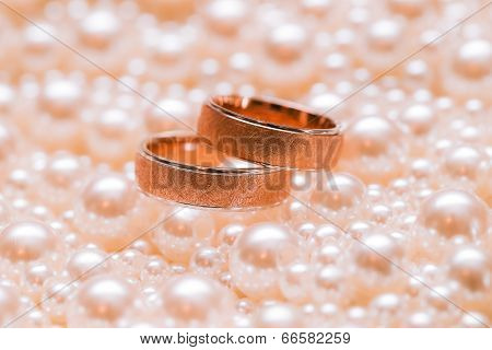 Douple Of Gold Wedding Rings On Scatterings Of Pearls. Wedding Accessories.