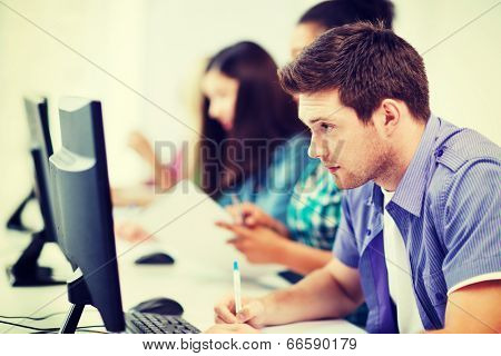 education concept - student with computer studying at school