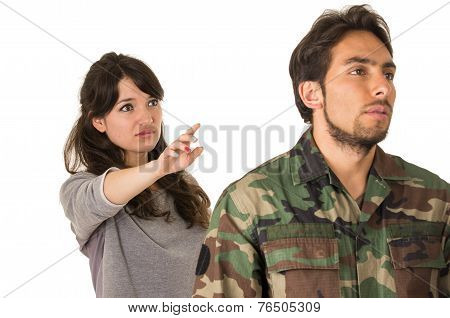 wife of military soldier waving goodbye