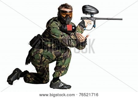 Painball player in action isolated