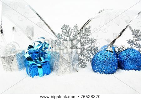 Silver,blue Christmas Baubles,gifts,snowflake With Silver Ribbon On Snow