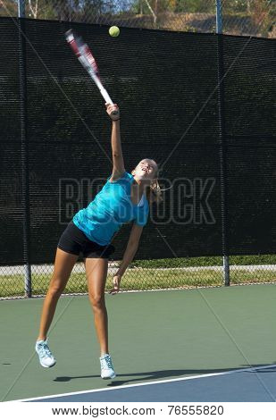 Junior Tennis Player Serving