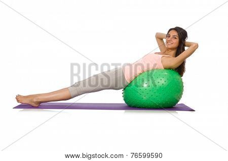 Young woman exercising with swiss ball