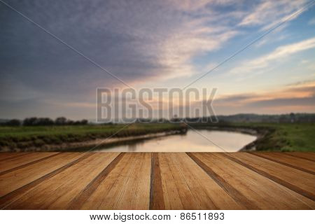 Stunning Vibrant Sunrise Reflected In Calm River  With Wooden Planks Floor