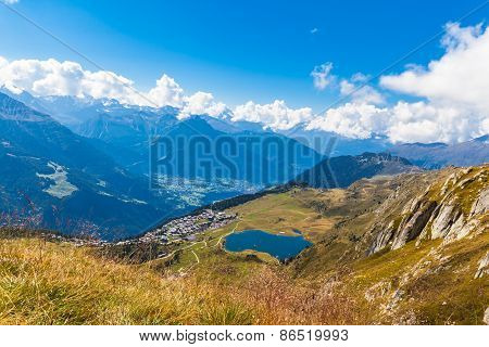 Bettmersee (lake) And The Alps In Valais