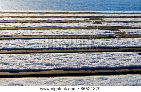 Bridge Made Of Plank With Snow And Ocean
