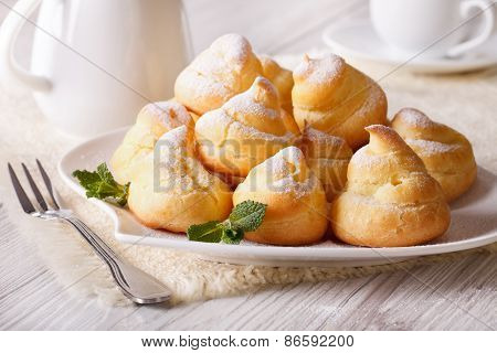 Profiteroles Topped With Powdered Sugar, Horizontal