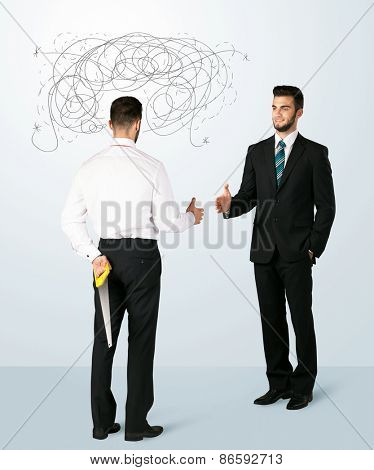 Ruthless businessman hiding a weapon and weaving plan around his head